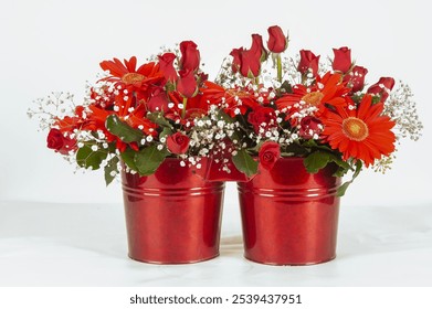 Flower arrangement of red roses, red chrysanthemums and gypsophila flower  in a red painted bucket - Powered by Shutterstock