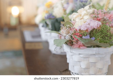 A flower basket of dried flowers photographed with bright natural light