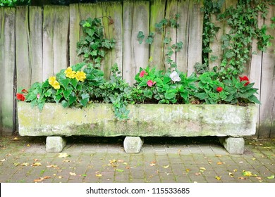 Flower Bed Near Board Fence