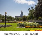 Flower beds and gardens of Civic Center Park with the gold leaf covered dome of State Capitol of Colorado in background