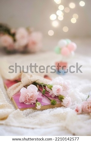 Flower and book in softtone, selective focus, blurred background Stock photo © 