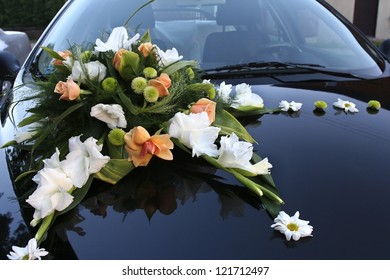 Flower bouquet on a wedding car