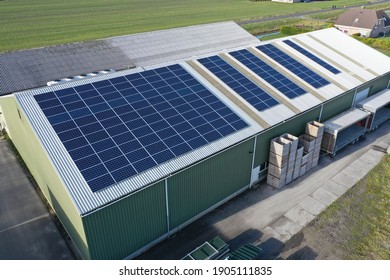 Flower Bulb Company With Solar Panels In A Row On A Roof. Photo Taken With A Drone