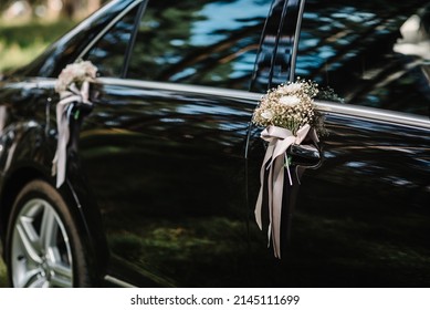 Flower Decor On Black Car. Wedding Car With Beautiful Decorations.