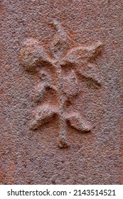 Flower Decoration On A Old Grave Stone.