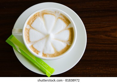 Flower Drawing On Latte Art Coffee.