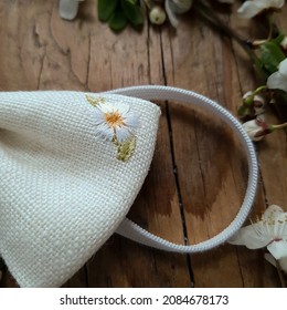 Flower Embroidery On A Hair Band.