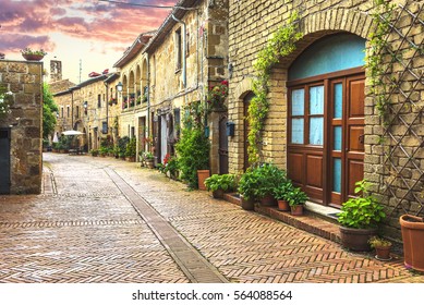 Flower filled streets of the old Italian city in Tuscany.