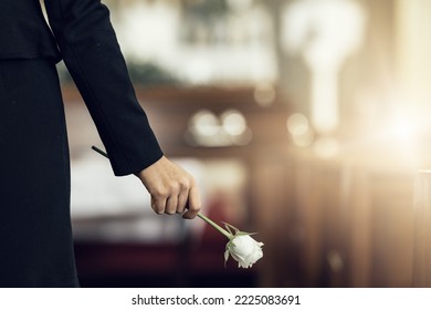 Flower, funeral and hand holding rose in mourning at death ceremony with grief for loss burial. Floral, church or cemetary with person holding plant for sad bereavement or cemetary event in a chapel - Shutterstock ID 2225083691