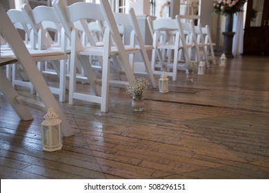 Flower In Glass Jar Along Wedding Aisle