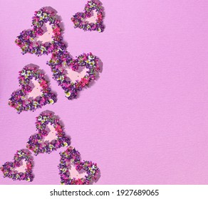 Flower hearts on pink backgrounds. Spring concept