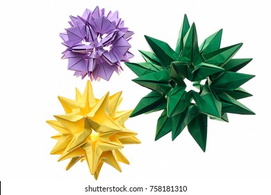 Flower Kusudama Models On White. Yellow, Green And Violet Origami Crafts Made By Young Artist. Cool Art Projects.