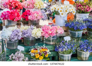 Flower market. Sweet peas, chamomile, cornflower and other flowers - Shutterstock ID 1374474122