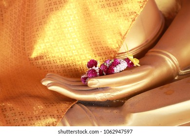 Flower On The Hand Of Buddha Image God Within Gold Colored In The Ayutthaya Historical Park - Thailand