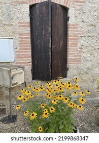 Flower Pot In Old French Village Outside Of Toulouse.