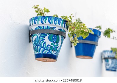 Flower pots decorating typical Andalusian houses in Mijas, Malaga province, southern Spain