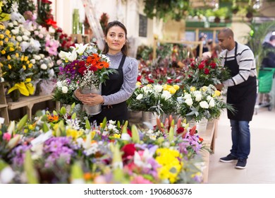 Flower seller prepares a luxury bouquet at a flower shop - Powered by Shutterstock