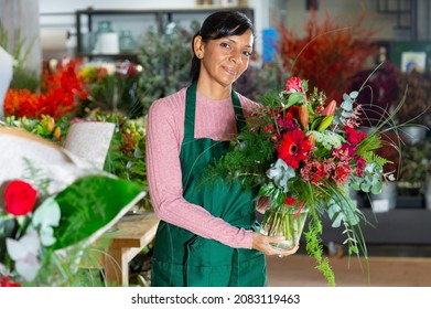 Flower seller prepares a luxury bouquet at a flower shop - Powered by Shutterstock