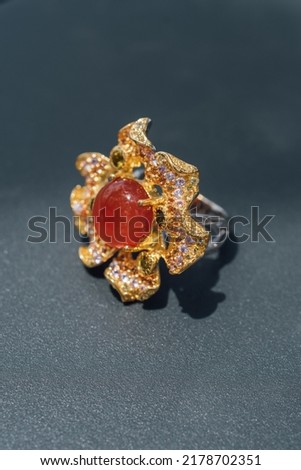 Flower shape gold ring and gemstone design