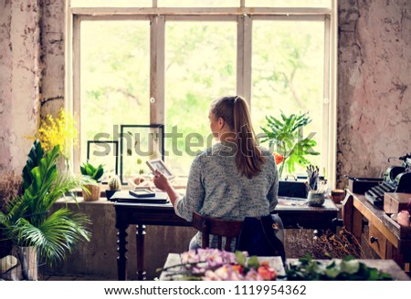 Similar – Woman makes wildflower bouquet in vase on the table