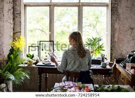 Similar – Woman makes wildflower bouquet in vase on the table