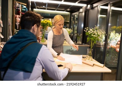 A Flower Shop Customer Is Waiting For A Bouquet To Be Bought For Him