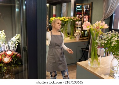 Flower Shop Worker Chooses Flowers For A Bouquet