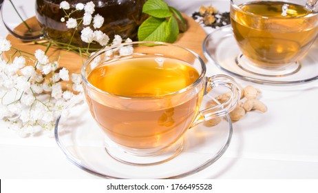 Flower Tea With Fruit Slices. A Cup Of Green Tea And A Teapot. Tea Ceremony, Traditional Drink. Afternoon Tea, Homelike. Flat Lay. Oriental, Cozy, Preparation, Heat, Tradition, Japanese, Leafy, Herbal