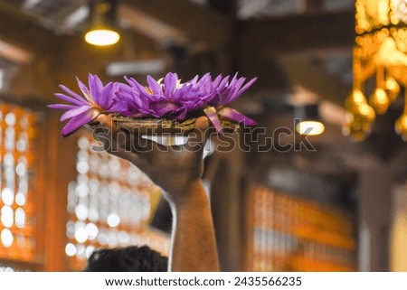 Flower vases that devotees take to worship Tooth Relic at Temple of the Tooth (Sri Dalada Maligawa), Kandy, Sri Lanka.