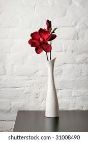 Flower In The White Vase On The Table