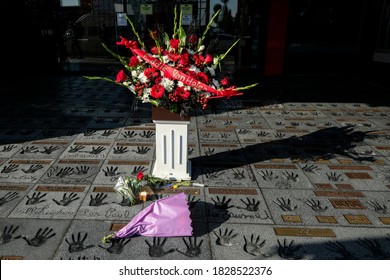 Flowers, Candle And Cigarette Are Placed At Eddie Van Halen’s Hand Prints At The California Rockwalk Of Fame In Los Angeles, Tuesday, Oct. 6, 2020.