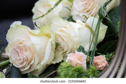 Flowers In The Cemetery. Water Drops On Flowers Standing On Graves. Rainy Weather On All Saints' Day.