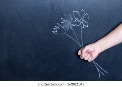 Flowers and child's hand abstract background concept
