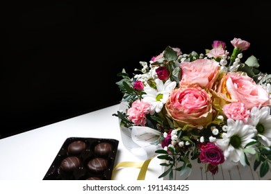 Flowers And Chocolate. Flowers, Bridal Bouquet Close-up. Decoration Of Roses, Peonies And Ornamental Plants. Gift For Valentines Day Women Day. Mothers Day. White And Black Background Selective Focus.