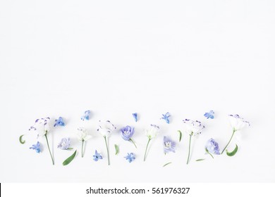 Flowers composition. Border made of lilac and white flowers. Flat lay, top view