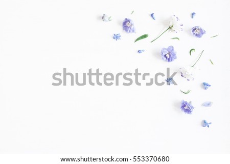 Flowers composition. Border made of lilac and white flowers. Flat lay, top view, copy space