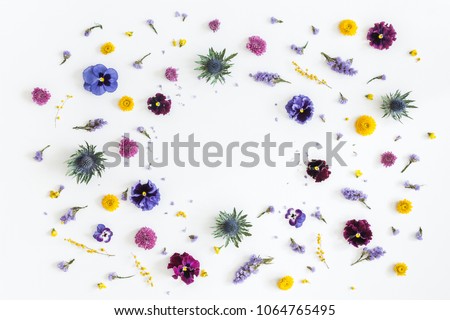 Flowers composition. Frame made of colorful flowers on gray background. Flat lay, top view, copy space