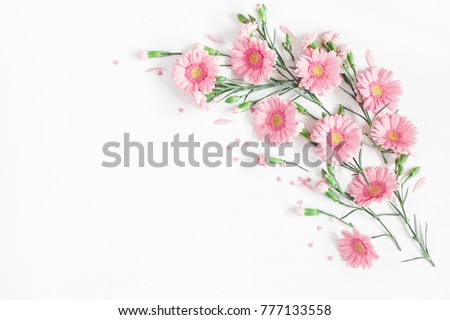 Flowers composition. Frame made of pink flowers on white background. Valentine's Day background. Flat lay, top view, copy space.