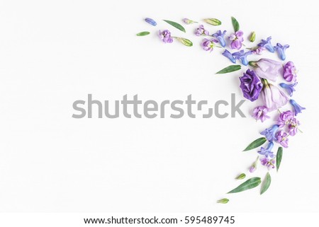 Flowers composition. Frame made of various colorful flowers on white background. Flat lay, top view