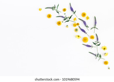 Flowers composition. Frame made of yellow, purple flowers and eucalyptus branches on white background. Flat lay, top view, copy space - Shutterstock ID 1019680594