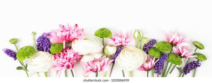 Flowers composition made of ranunculus, chrysanthemum and other flowers on white background. Flat lay, top view.
