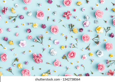 Flowers composition. Pattern made of colorful flowers on pastel blue background. Spring, easter, summer concept. Flat lay, top view