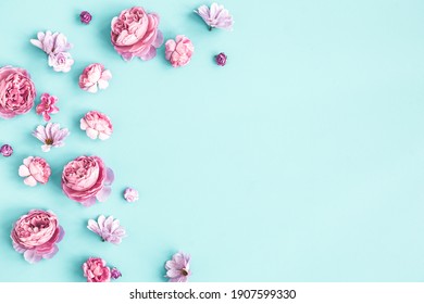 Flowers Composition. Pink Flowers On Pastel Blue Background. Flat Lay, Top View