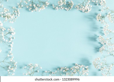 Flowers composition romantic. White gypsophila flowers on pastel blue background. Valentine's Day, Easter, Birthday, Happy Women's Day, Mother's day. Flat lay, top view, copy space