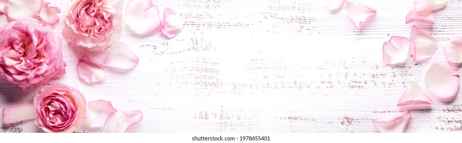 Flowers Composition. Rose Flower Petals On Wooden Background