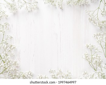 Flowers composition. White flowers on white background. Wedding mockup with small flowers. Flat lay, top view, frame. Gypsophila Baby's-breath flowers - Powered by Shutterstock
