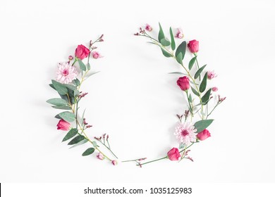 Flowers composition. Wreath made of various pink flowers and eucalyptus branches on white background. Flat lay, top view, copy space