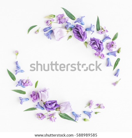 Flowers composition. Wreath made of various colorful flowers on white background. Spring, summer concept. Flat lay, top view.