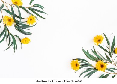 Flowers composition. Yellow flowers and eucalyptus leaves on white background. Spring, easter concept. Flat lay, top view, copy space - Shutterstock ID 1364337659