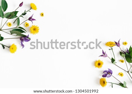 Flowers composition. Yellow and purple flowers on white background. Spring, easter concept. Flat lay, top view, copy space